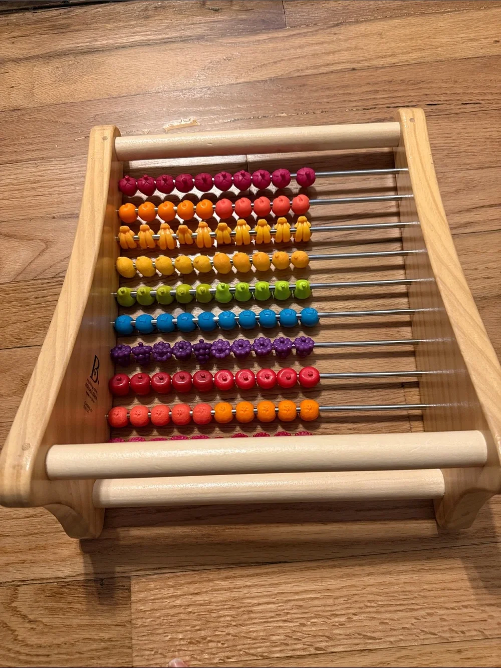 B. Toys Wooden fruit Counting Abacus - Multicolor like new